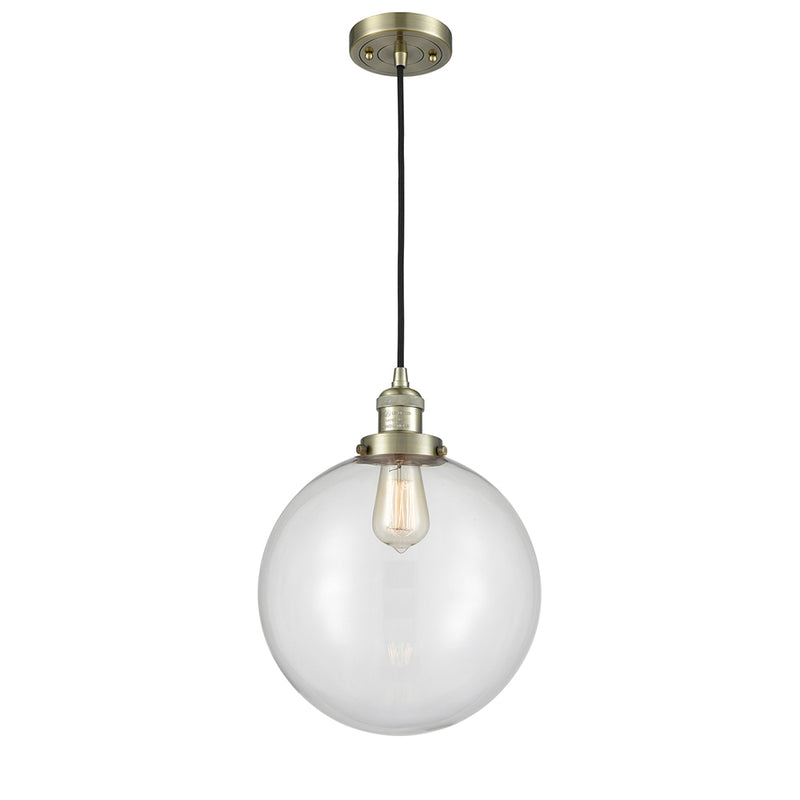 Beacon Mini Pendant shown in the Antique Brass finish with a Clear shade