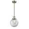 Beacon Mini Pendant shown in the Antique Brass finish with a Clear shade