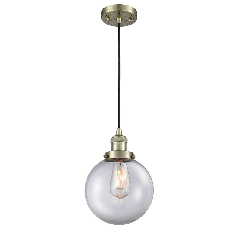 Beacon Mini Pendant shown in the Antique Brass finish with a Clear shade