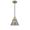 Cone Mini Pendant shown in the Antique Brass finish with a Plated Smoke shade