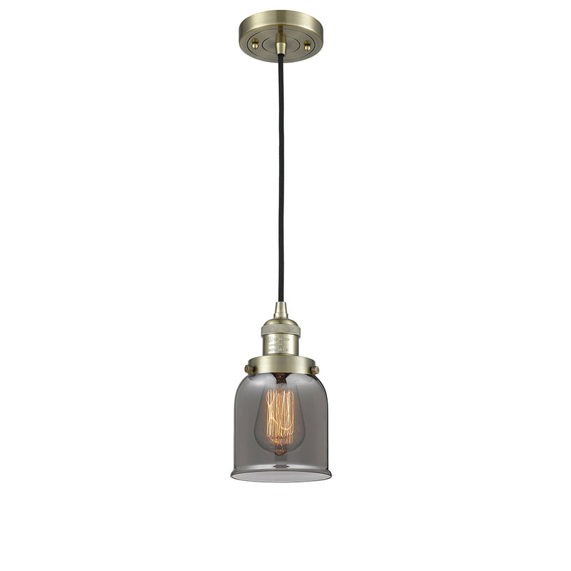 Bell Mini Pendant shown in the Antique Brass finish with a Plated Smoke shade