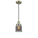 Bell Mini Pendant shown in the Antique Brass finish with a Plated Smoke shade