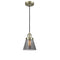 Cone Mini Pendant shown in the Antique Brass finish with a Plated Smoke shade