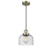 Bell Mini Pendant shown in the Antique Brass finish with a Seedy shade