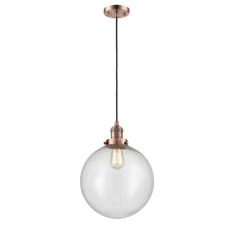 Beacon Mini Pendant shown in the Antique Copper finish with a Seedy shade