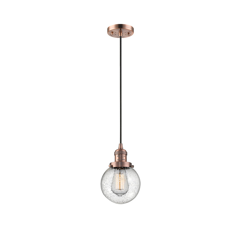 Beacon Mini Pendant shown in the Antique Copper finish with a Seedy shade