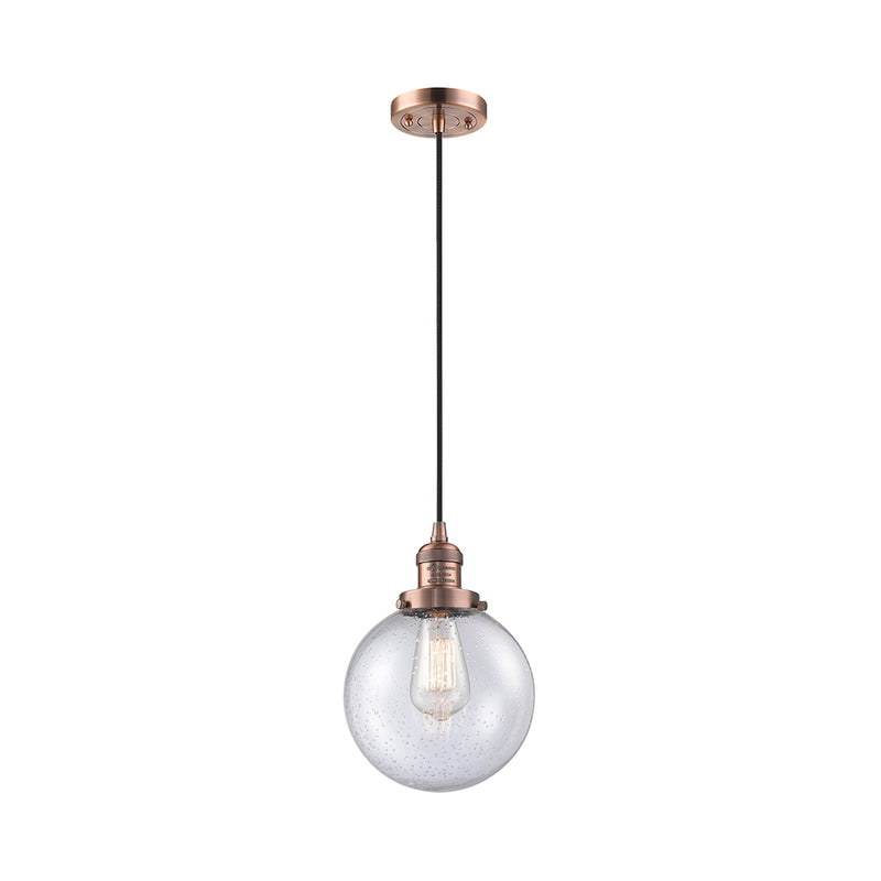 Beacon Mini Pendant shown in the Antique Copper finish with a Seedy shade