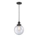 Beacon Mini Pendant shown in the Matte Black finish with a Seedy shade