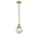 Beacon Mini Pendant shown in the Satin Gold finish with a Seedy shade