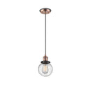 Beacon Mini Pendant shown in the Antique Copper finish with a Seedy shade