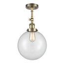 Beacon Semi-Flush Mount shown in the Antique Brass finish with a Clear shade