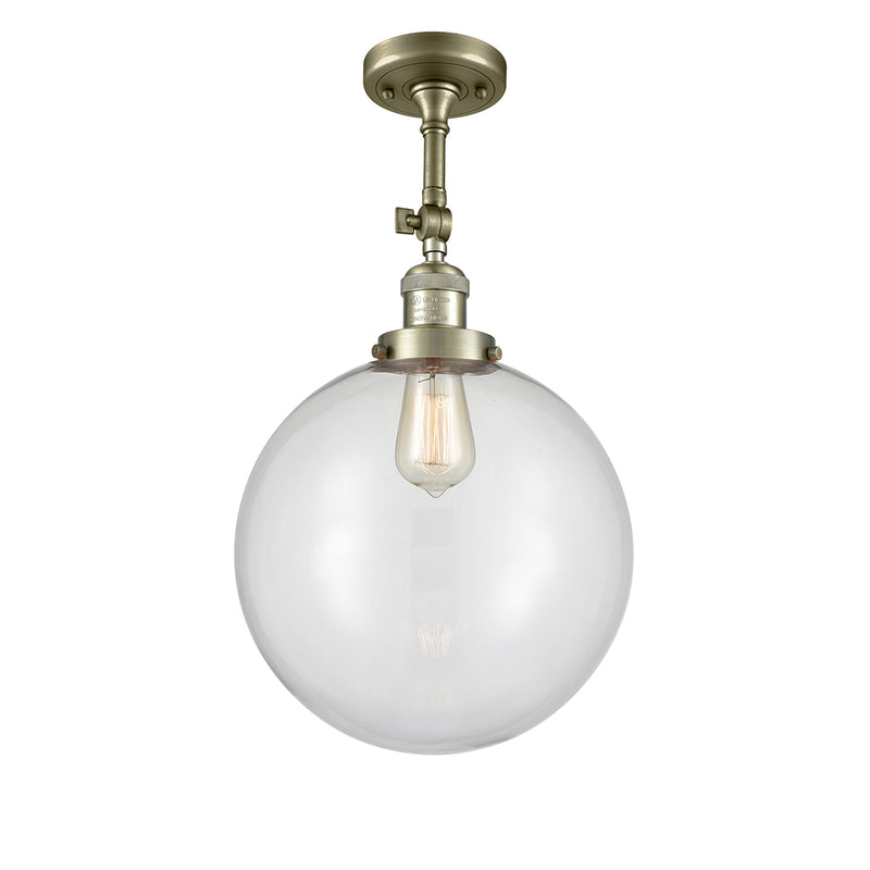 Beacon Semi-Flush Mount shown in the Antique Brass finish with a Clear shade