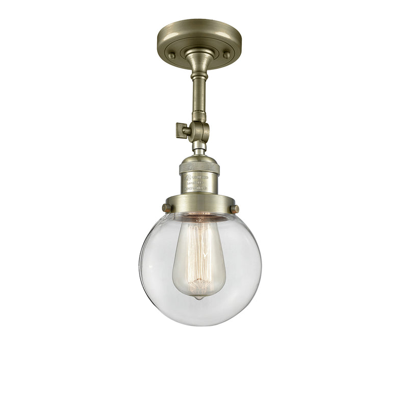 Beacon Semi-Flush Mount shown in the Antique Brass finish with a Clear shade