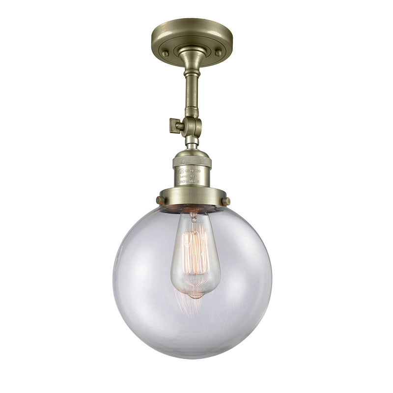 Beacon Semi-Flush Mount shown in the Antique Brass finish with a Clear shade