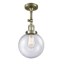 Beacon Semi-Flush Mount shown in the Antique Brass finish with a Seedy shade