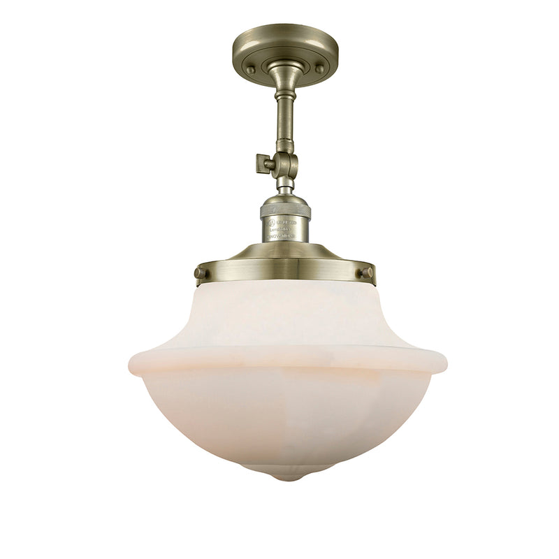 Oxford Semi-Flush Mount shown in the Antique Brass finish with a Matte White shade