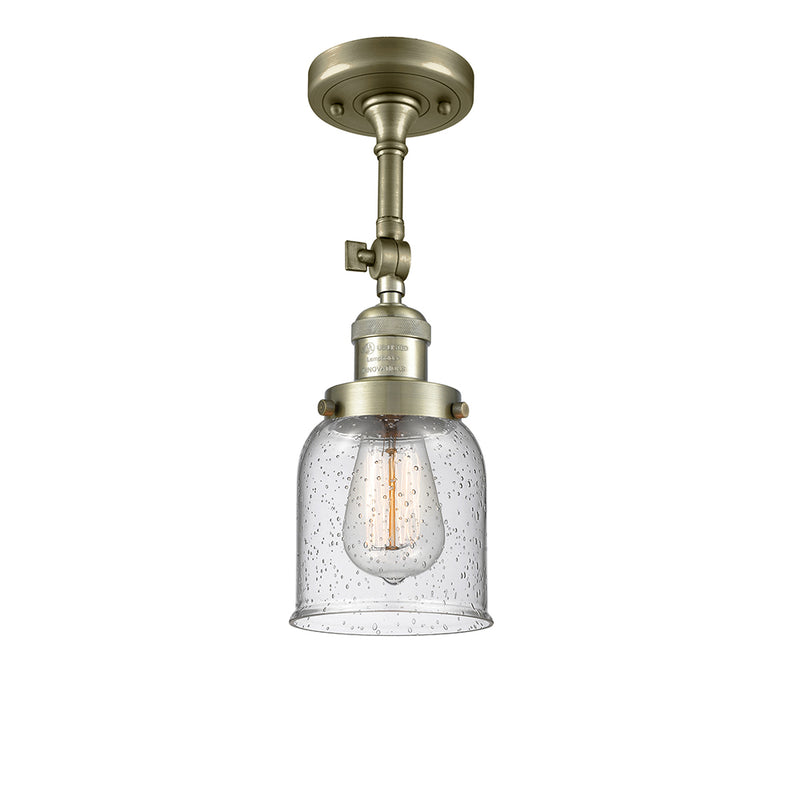 Bell Semi-Flush Mount shown in the Antique Brass finish with a Seedy shade