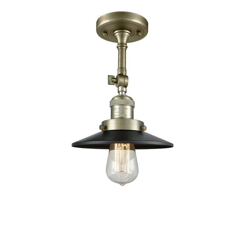 Railroad Semi-Flush Mount shown in the Antique Brass finish with a Matte Black shade