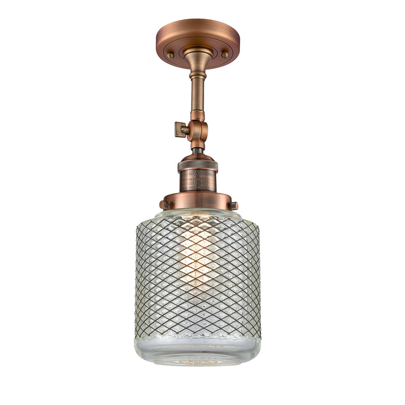 Stanton Semi-Flush Mount shown in the Antique Copper finish with a Clear Wire Mesh shade