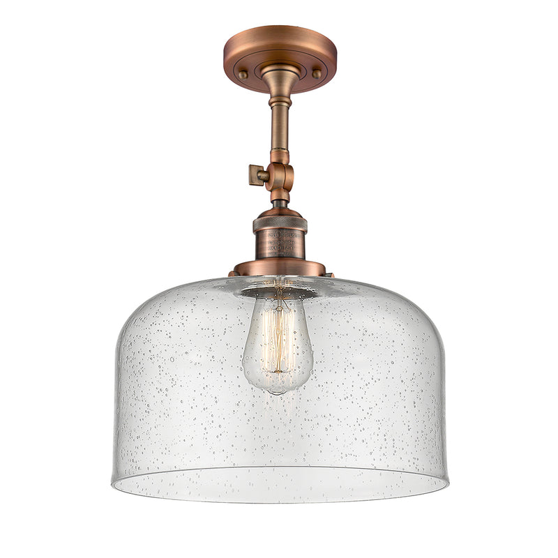 Bell Semi-Flush Mount shown in the Antique Copper finish with a Seedy shade