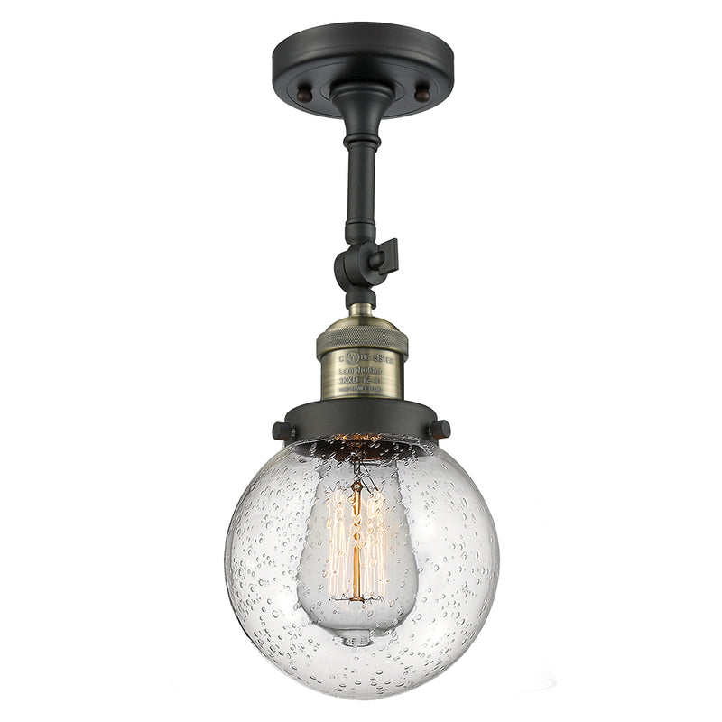 Beacon Semi-Flush Mount shown in the Black Antique Brass finish with a Seedy shade