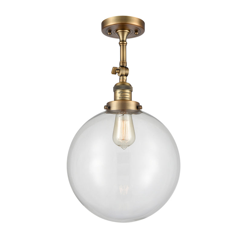 Beacon Semi-Flush Mount shown in the Brushed Brass finish with a Clear shade