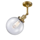 Beacon Semi-Flush Mount shown in the Brushed Brass finish with a Seedy shade