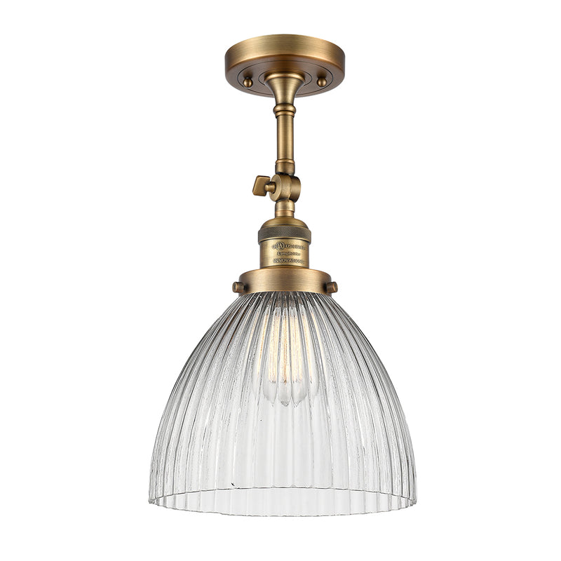 Seneca Falls Semi-Flush Mount shown in the Brushed Brass finish with a Clear Halophane shade