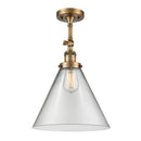 Cone Semi-Flush Mount shown in the Brushed Brass finish with a Clear shade