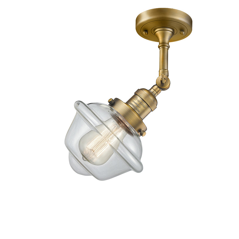 Oxford Semi-Flush Mount shown in the Brushed Brass finish with a Clear shade