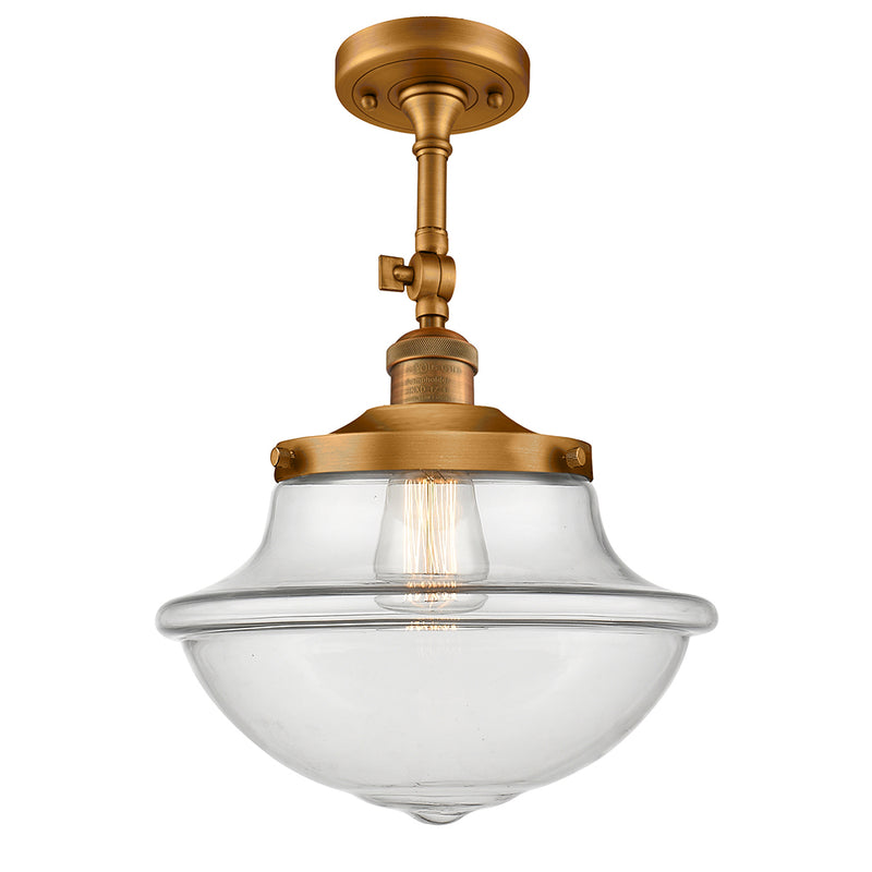 Oxford Semi-Flush Mount shown in the Brushed Brass finish with a Clear shade