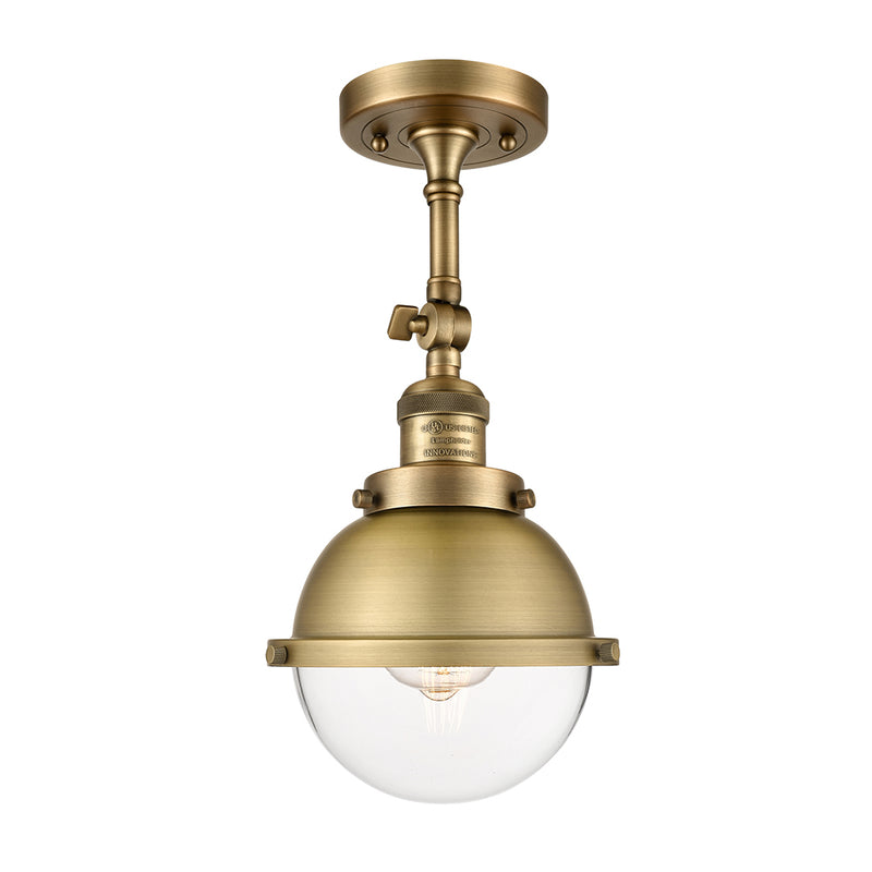 Hampden Semi-Flush Mount shown in the Brushed Brass finish with a Clear shade