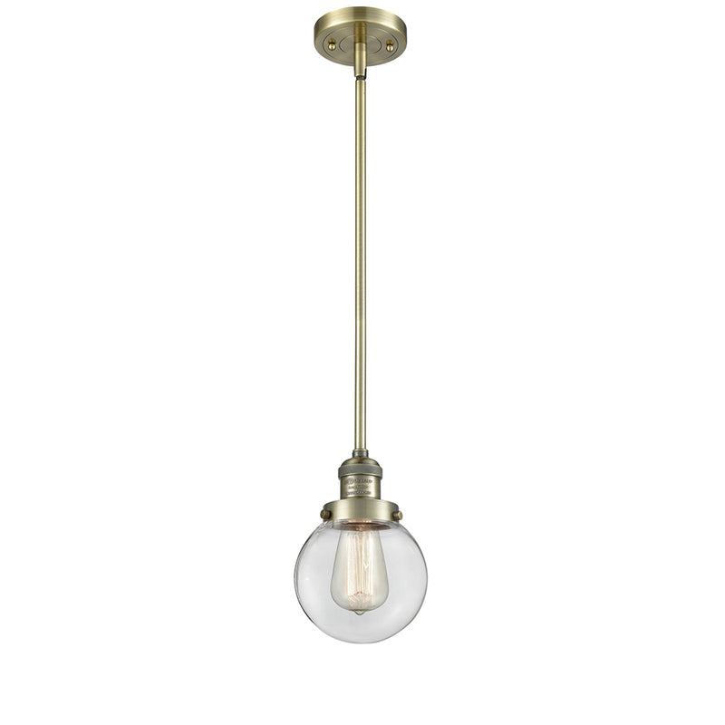 Beacon Mini Pendant shown in the Antique Brass finish with a Clear shade