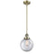 Beacon Mini Pendant shown in the Antique Brass finish with a Clear shade