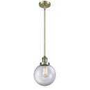 Beacon Mini Pendant shown in the Antique Brass finish with a Clear shade