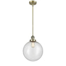 Beacon Mini Pendant shown in the Antique Brass finish with a Seedy shade