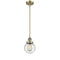 Beacon Mini Pendant shown in the Antique Brass finish with a Seedy shade