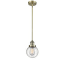 Beacon Mini Pendant shown in the Antique Brass finish with a Seedy shade