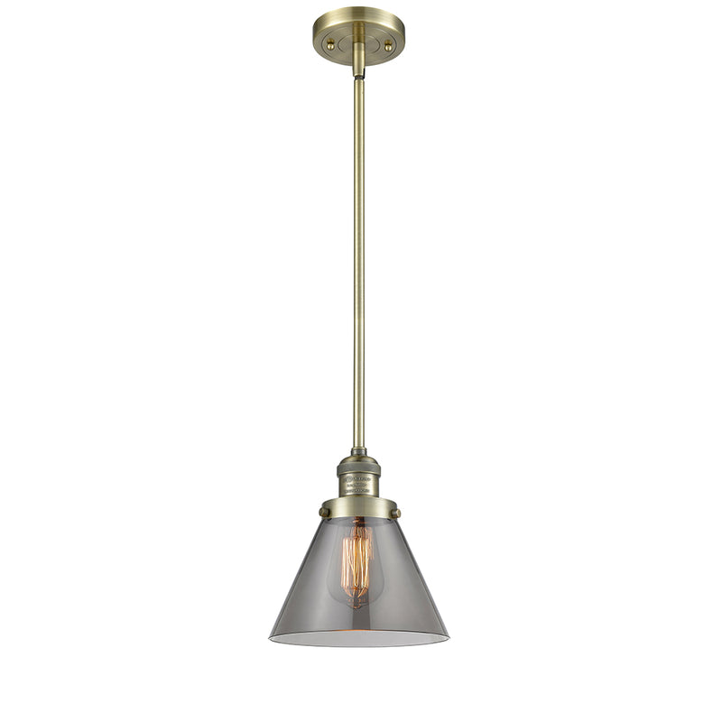 Cone Mini Pendant shown in the Antique Brass finish with a Plated Smoke shade