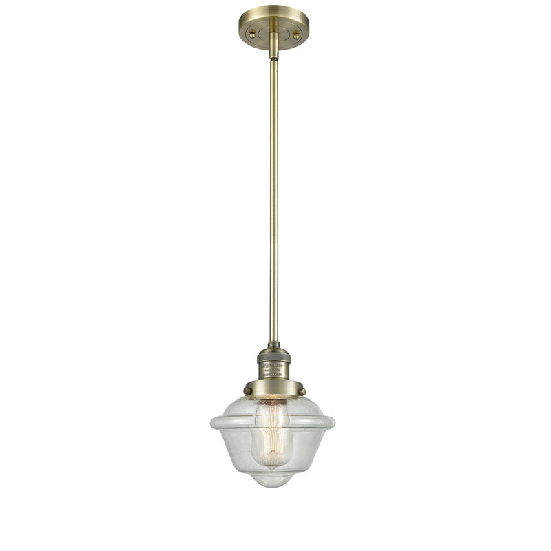 Oxford Mini Pendant shown in the Antique Brass finish with a Seedy shade