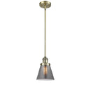 Cone Mini Pendant shown in the Antique Brass finish with a Plated Smoke shade