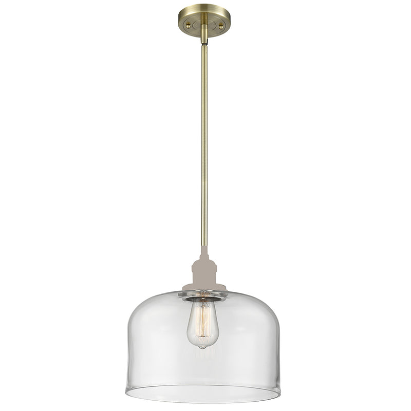 Bell Mini Pendant shown in the Antique Brass finish with a Clear shade