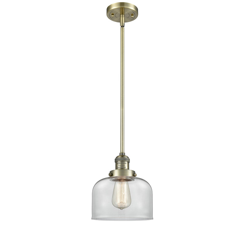 Bell Mini Pendant shown in the Antique Brass finish with a Clear shade