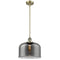 Bell Mini Pendant shown in the Antique Brass finish with a Plated Smoke shade