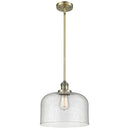 Bell Mini Pendant shown in the Antique Brass finish with a Seedy shade