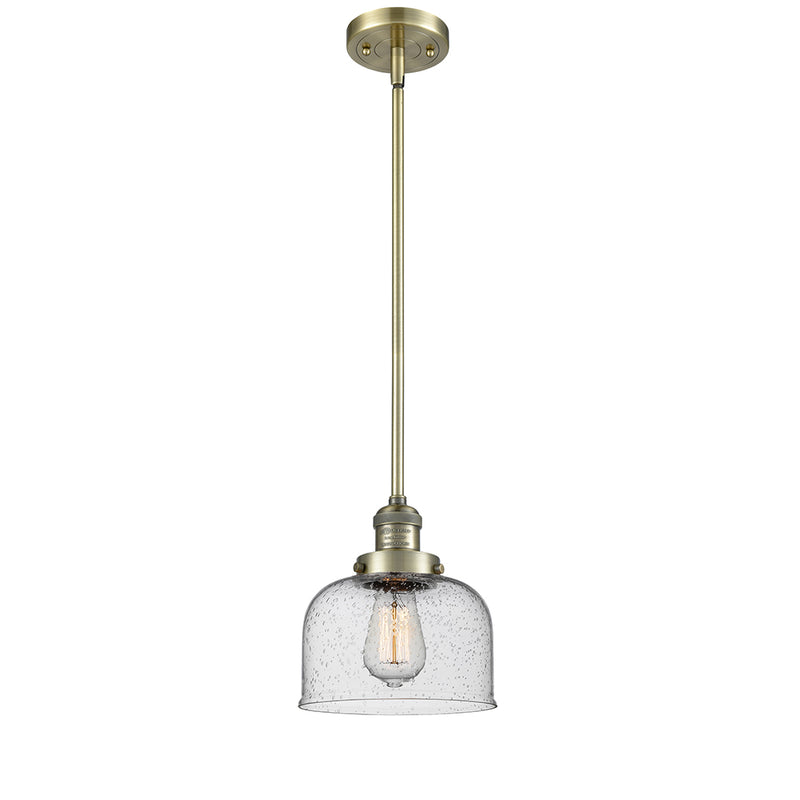 Bell Mini Pendant shown in the Antique Brass finish with a Seedy shade