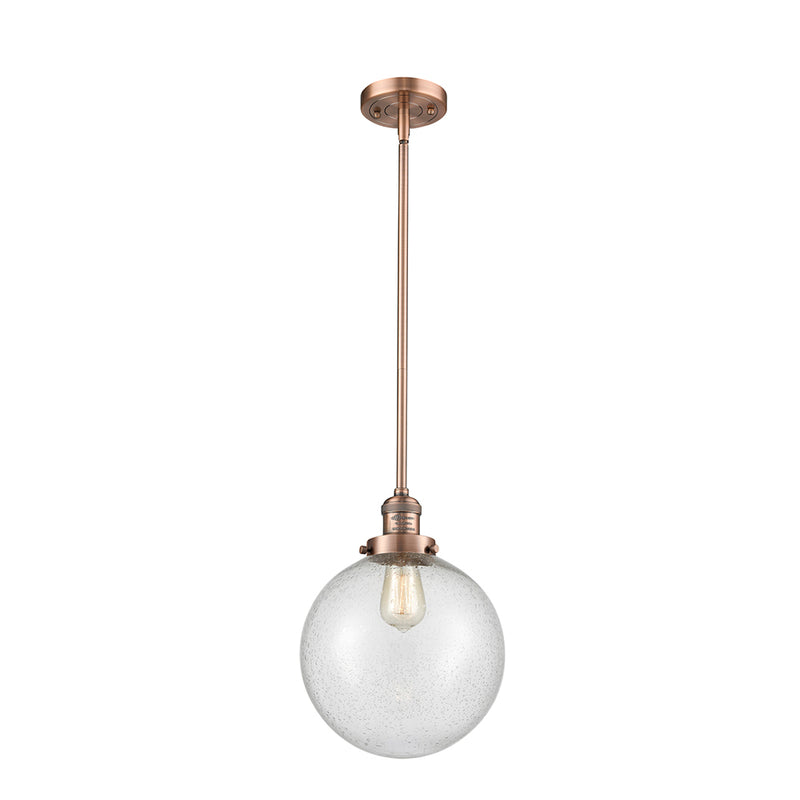 Beacon Mini Pendant shown in the Antique Copper finish with a Seedy shade