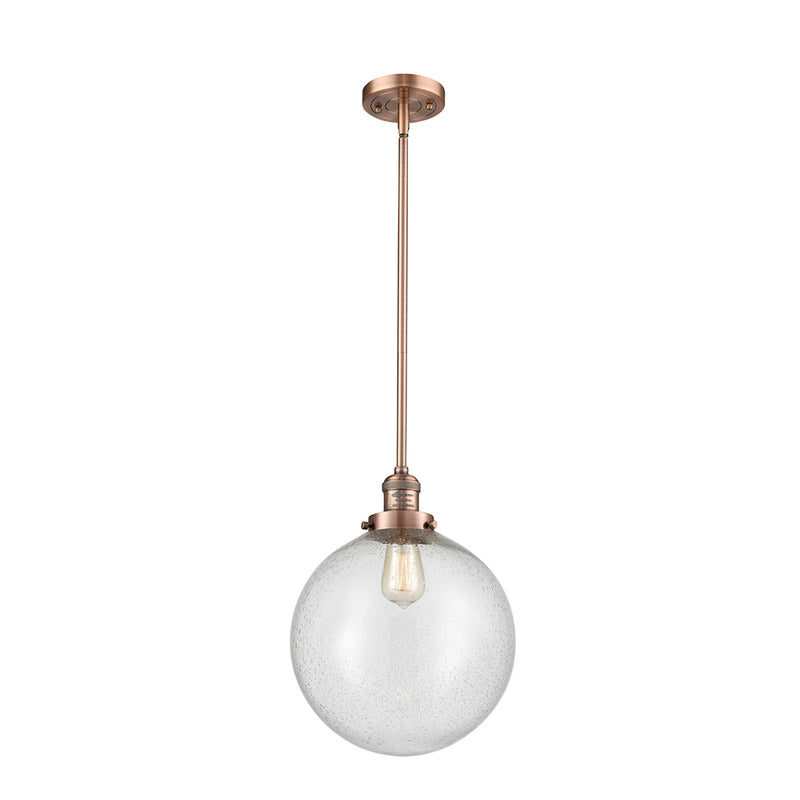 Beacon Mini Pendant shown in the Antique Copper finish with a Seedy shade