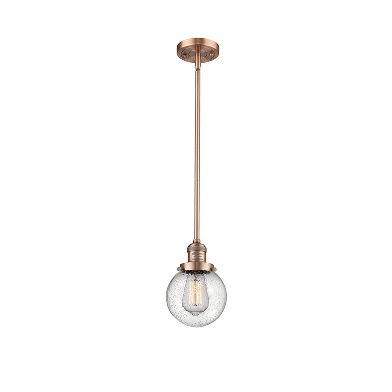 Beacon Mini Pendant shown in the Antique Copper finish with a Seedy shade