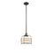 Bell Cage Mini Pendant shown in the Black Antique Brass finish with a Matte White shade